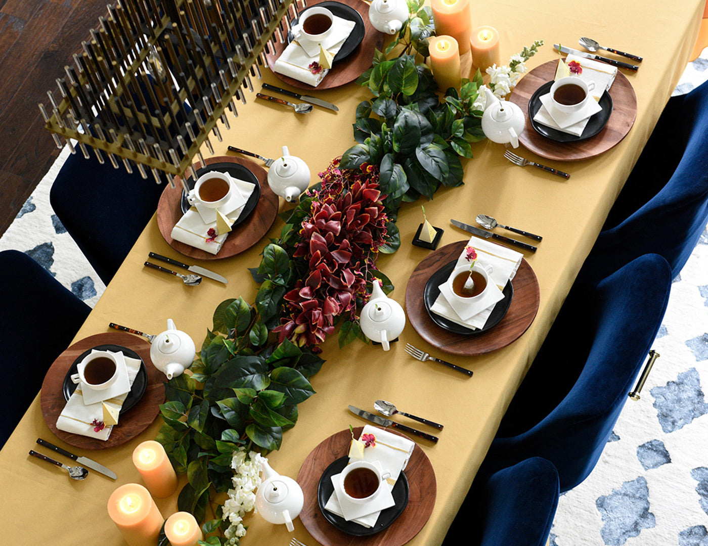 Solstice teaware on a large dining room table set for a dinner