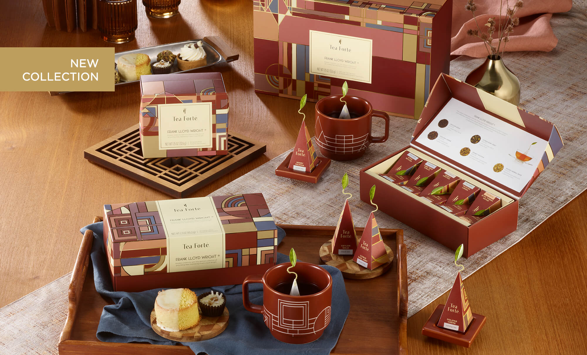 Frank Lloyd Wright Collection items on a wooden table with cake