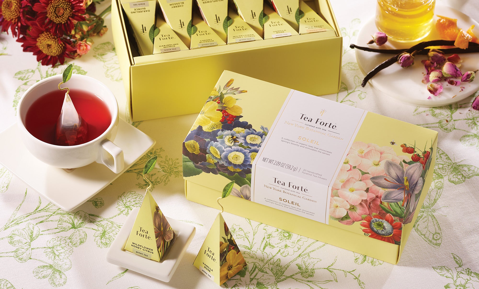 Soleil Collection Presentation Boxes and steeped tea in a cup