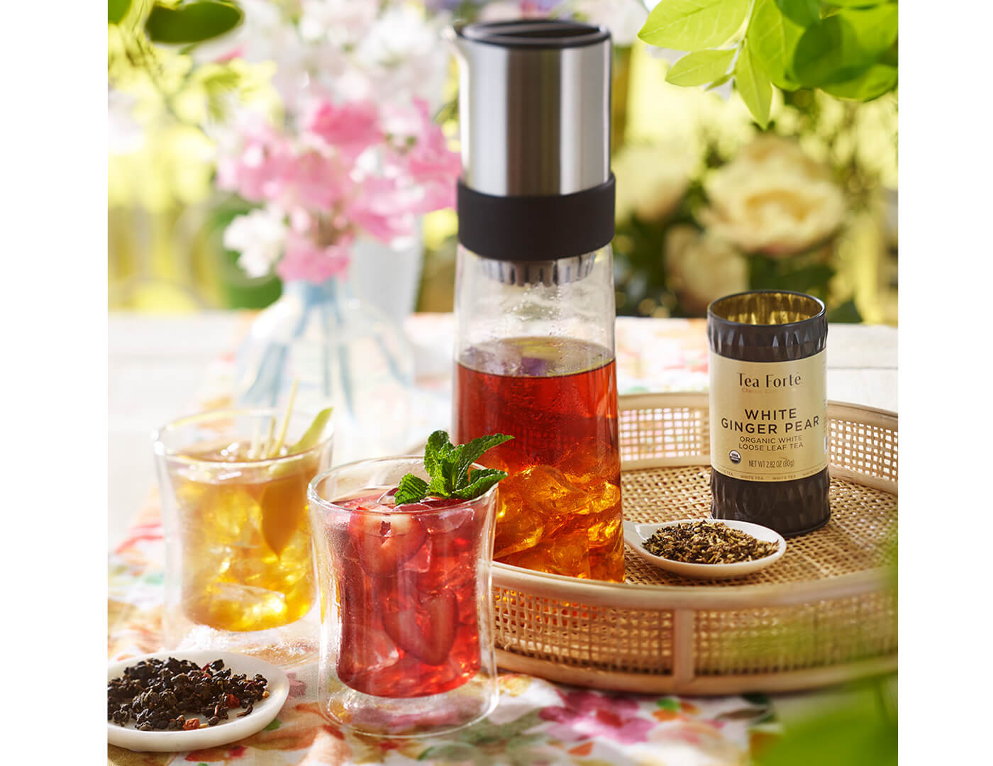 Tea jay Iced Tea maker with loose tea canister and POOM glasses of iced tea.