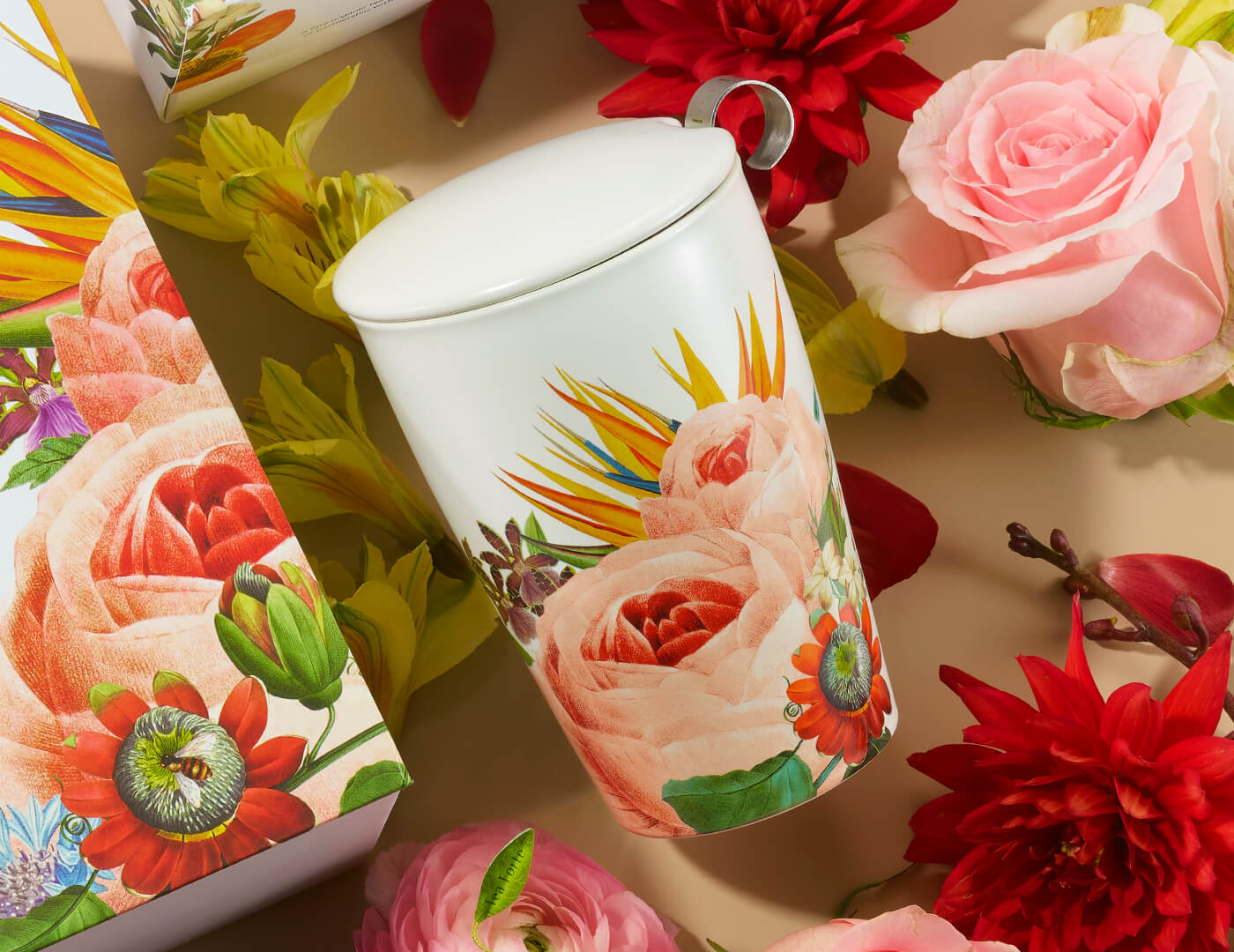 Jubilee Kati Steeping Cup, closed, with lid and infuser on a table of flowers