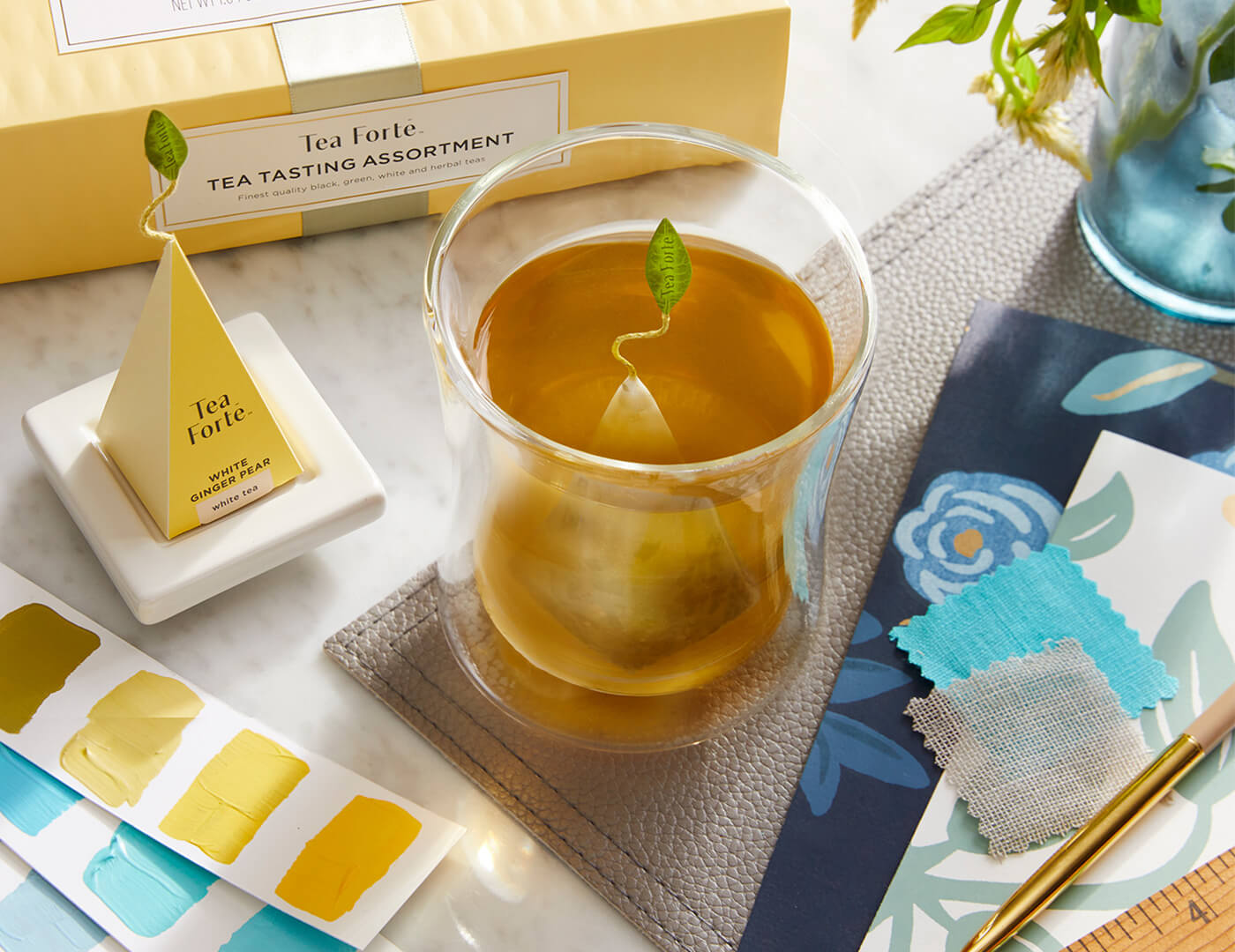 Poom Cup with box of tea and infuser on tray