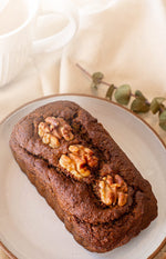 Pumpkin Spice Tea Loaf on a table with tea