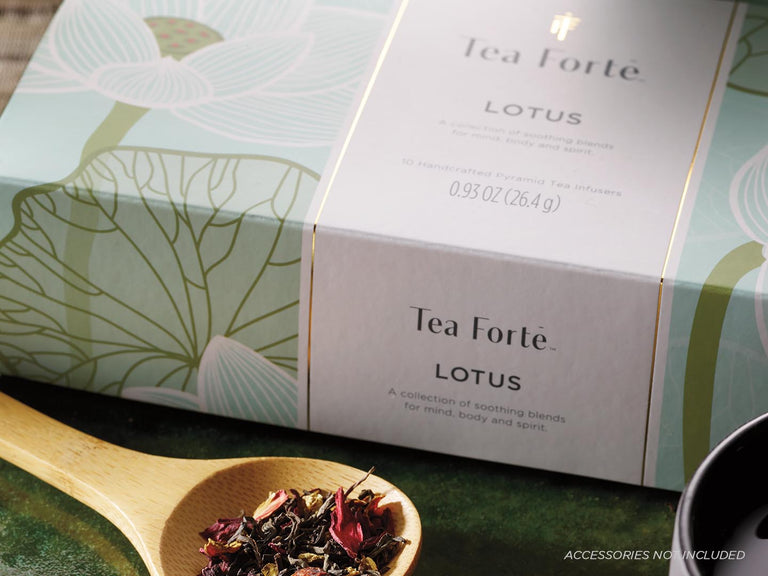 Image of Lotus Petite Presentation Box next to Tea Leaves in a Spoon