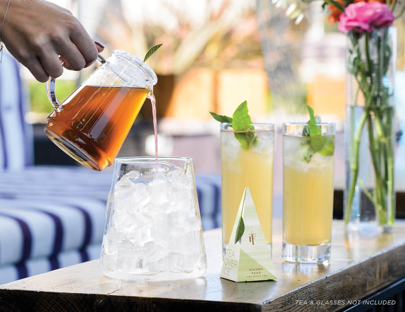 Pouring steeped tea over ice using the Tea Over Ice Pitcher Set